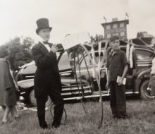 Bernard Hargrove preparing to mount the penny-farthing at the 1st Bath Fall Fair parade in 1944. Also pictured is Eugene Ketch.